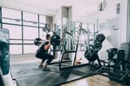 Build legs for days with heavy squats. (Image via Pexels/ Sam Mogadham Khamseh)